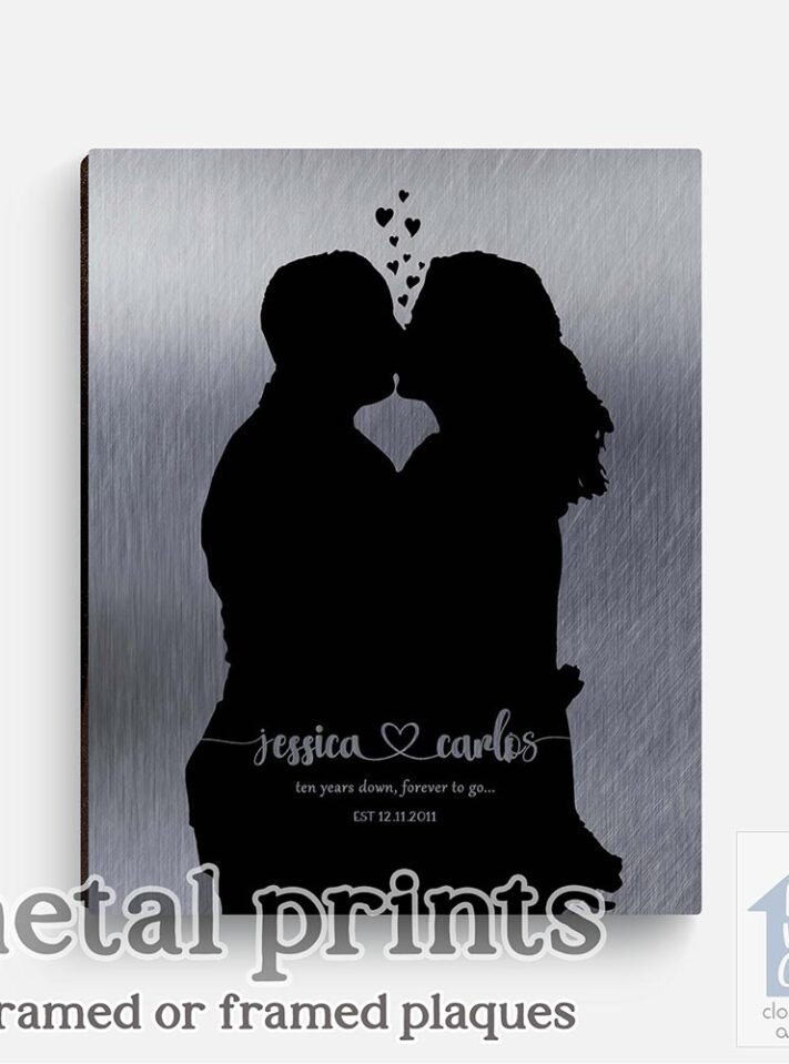 Relocation concept. A smiling cheerful multiracial couple in embraces lookin in each other eyes Relocation concept. A smiling cheerful multiracial couple in embraces lookin in each other eyes