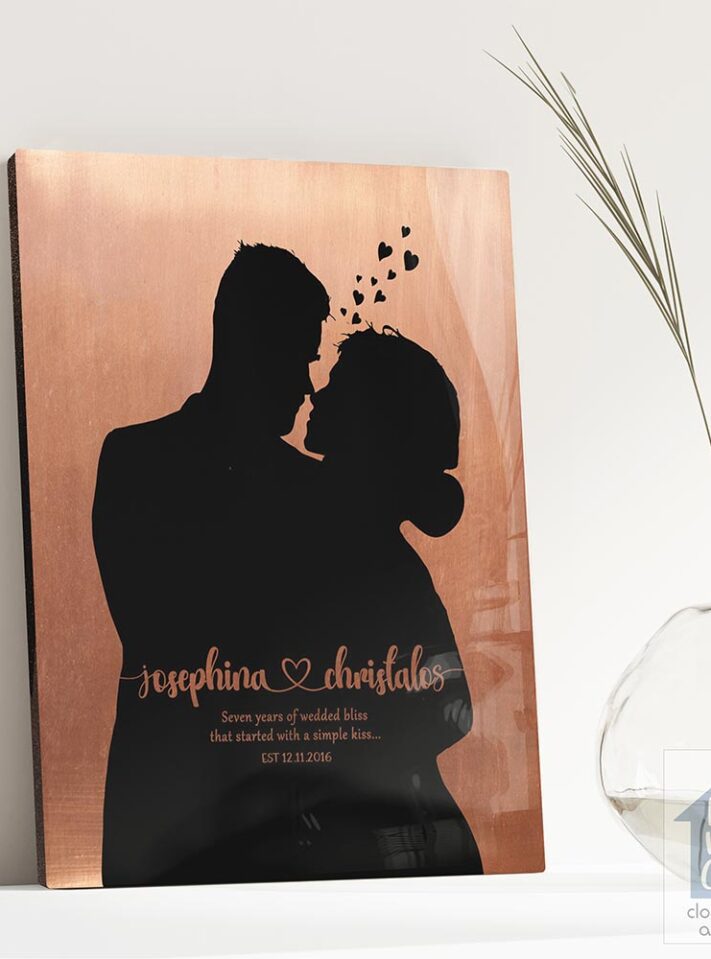 Relocation concept. A smiling cheerful multiracial couple in embraces lookin in each other eyes Relocation concept. A smiling cheerful multiracial couple in embraces lookin in each other eyes