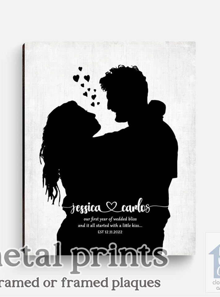 Relocation concept. A smiling cheerful multiracial couple in embraces lookin in each other eyes Relocation concept. A smiling cheerful multiracial couple in embraces lookin in each other eyes