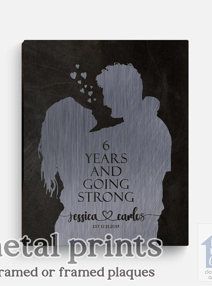 Relocation concept. A smiling cheerful multiracial couple in embraces lookin in each other eyes Relocation concept. A smiling cheerful multiracial couple in embraces lookin in each other eyes