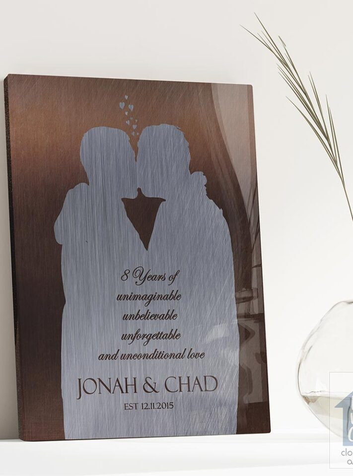 Relocation concept. A smiling cheerful multiracial couple in embraces lookin in each other eyes Relocation concept. A smiling cheerful multiracial couple in embraces lookin in each other eyes