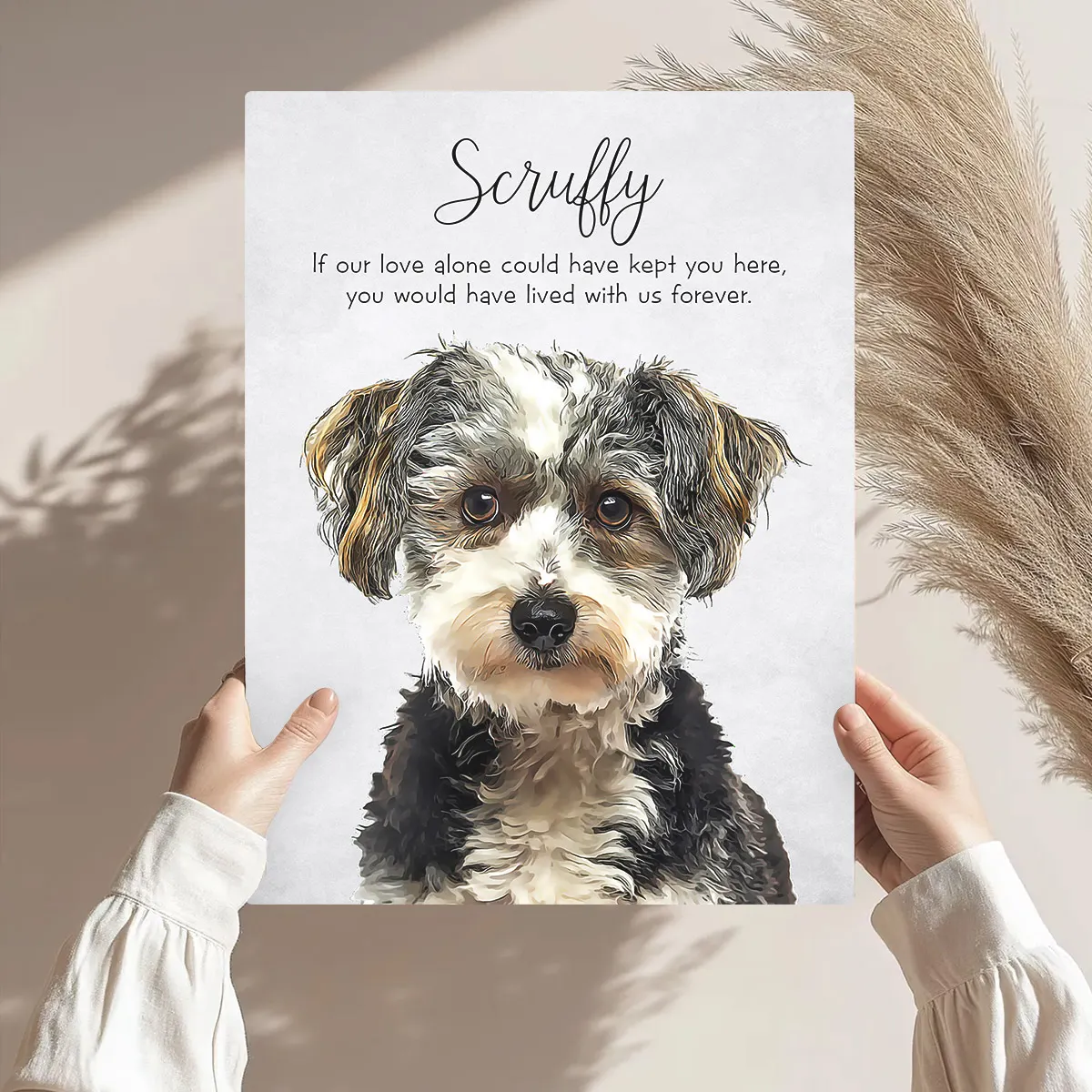 Pet memorial plaque held by a child with arms outstretched in front of pampas grass